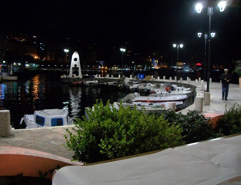 enjoying a pizza marinara and the night-time view in Sarandë