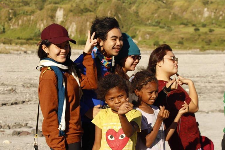 Look at this cute girl showing her Korean heart fingers towards the camera! 