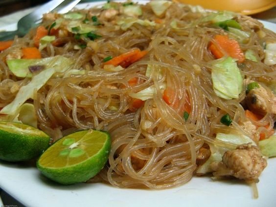 Pancit is stir-fried rice noodles with meat or seafood and veggies. This was a specialty of my lolo's because he had a *pancit* business before.