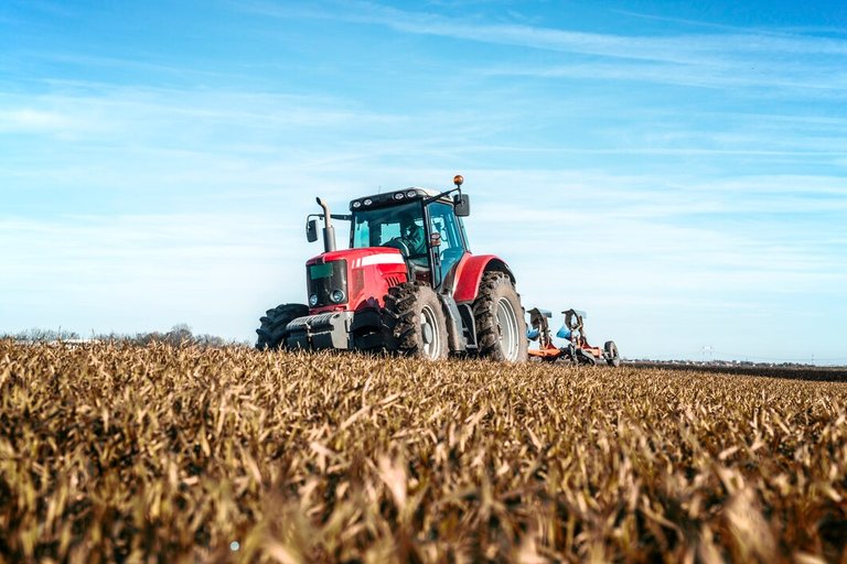 tractor-agricultural-machine-cultivating-field_342744-564.jpg