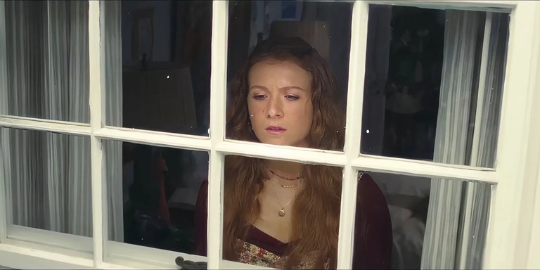 young-lily-looks-out-her-window-in-it-ends-with-us.jpg