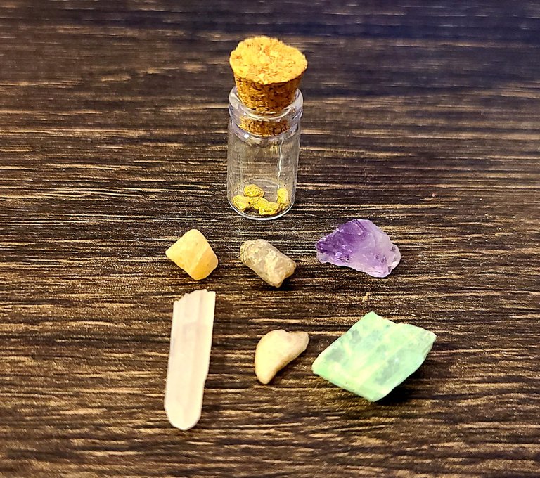 All of our finds from this one bag, including some raw emerald! (the over-exposed stone, bottom right)