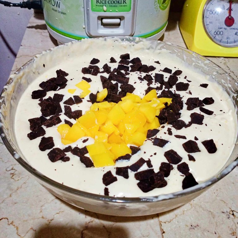 chopped mango and choco on top of mixture.jpg