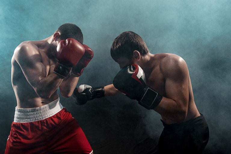 two-professional-boxer-boxing-on-black-smoky.jpg