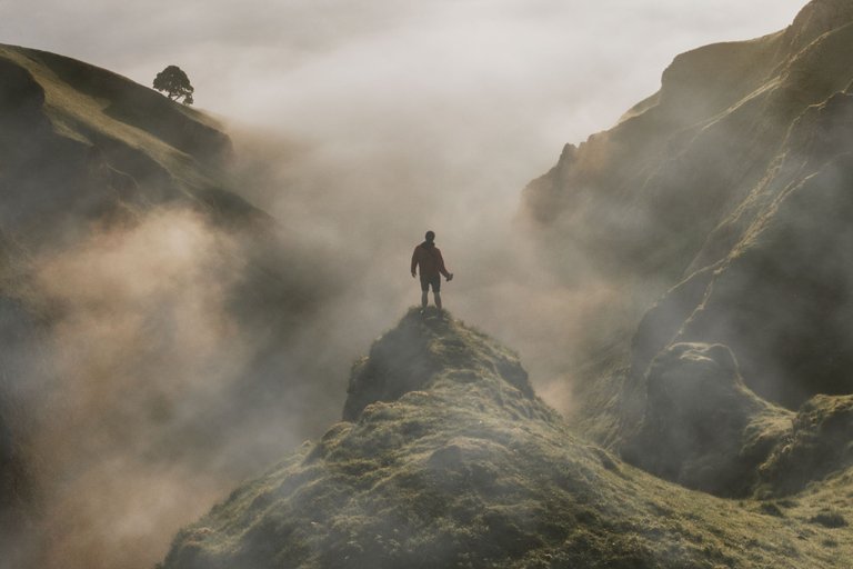 man-standing-cliff-with-fog-overlay-texture.jpg