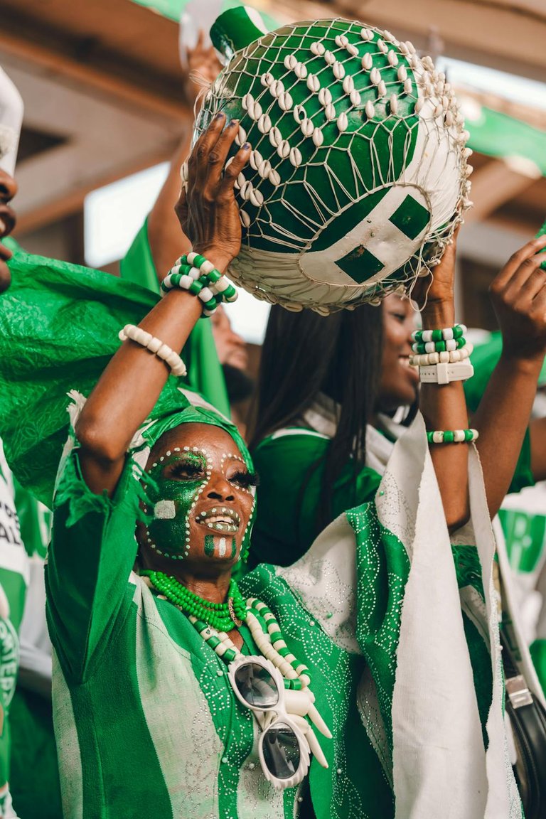 free-photo-of-vibrant-nigerian-fans-celebrating-cultural-festivity.jpeg