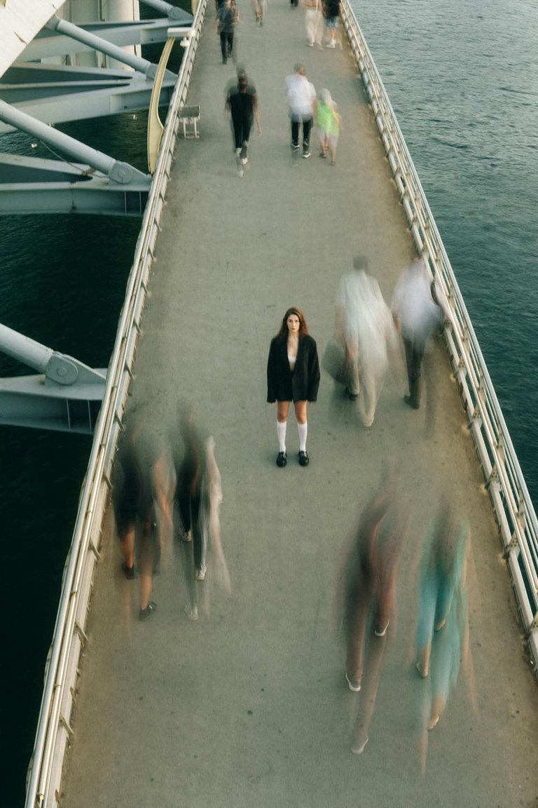 free-photo-of-woman-standing-on-footbridge.jpeg