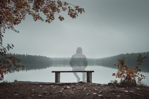 transparent-man-is-sitting-bench-looking-lake-back-view-autumn-theme_183270-63.jpg