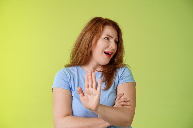 enough-wasting-my-time-ignorant-uninterested-redhead-mature-woman-turn-away-displeased-reluctant-show-stop-no-gesture-hold-palm-refusal-rejecting-unpleasant-offer-green-wall_1258-46293.jpg