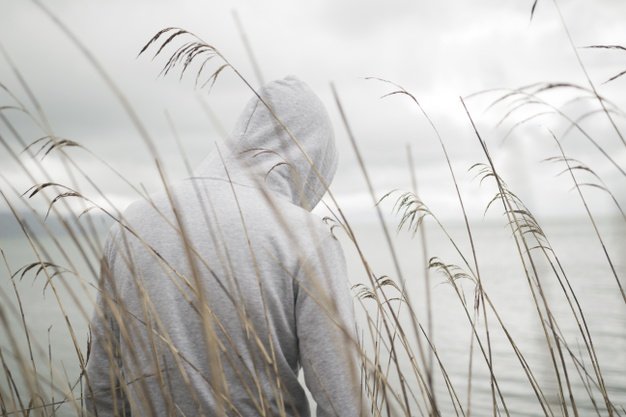 lonely-sad-person-from-with-hoodie-sitting-near-sea-thinking-about-life_181624-21979.jpg