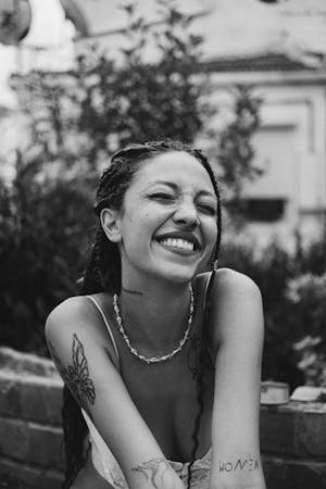 free-photo-of-smiling-woman-with-tattoos-outdoors-portrait.jpeg