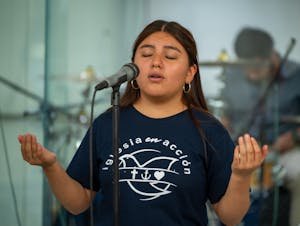 free-photo-of-a-girl-in-a-blue-shirt-singing-into-a-microphone.jpeg