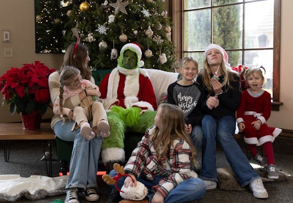 free-photo-of-family-celebrating-christmas-with-grinch-character.jpeg