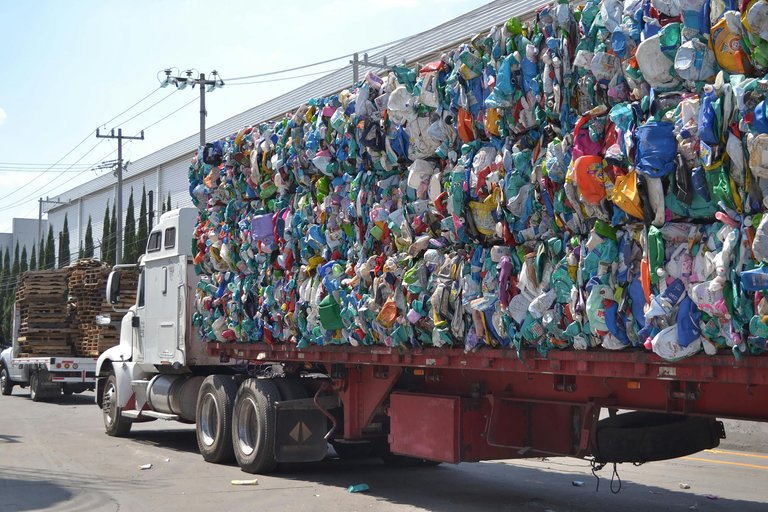 free-photo-of-a-truck-loaded-with-plastic-trash-driving-on-a-street-in-city.jpeg