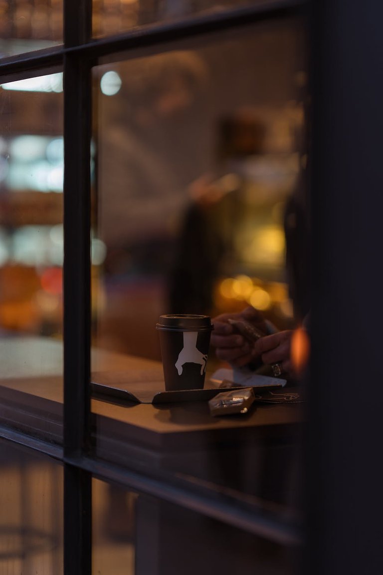 free-photo-of-coffee-cup-seen-through-cafe-window.jpeg