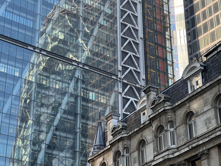 The Scalpel - reflections and juxtaposition with older buildings around it