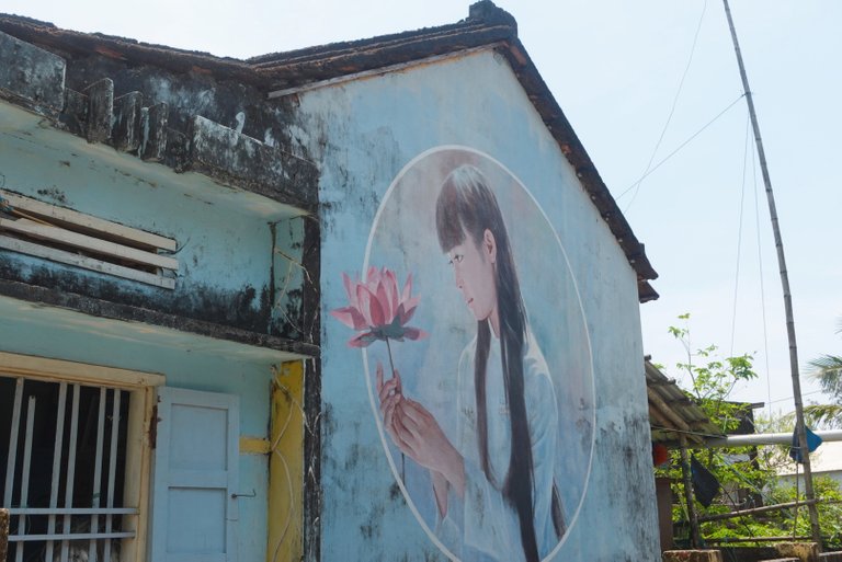 The picture of a girl in this village in a white Ao dai with lotus