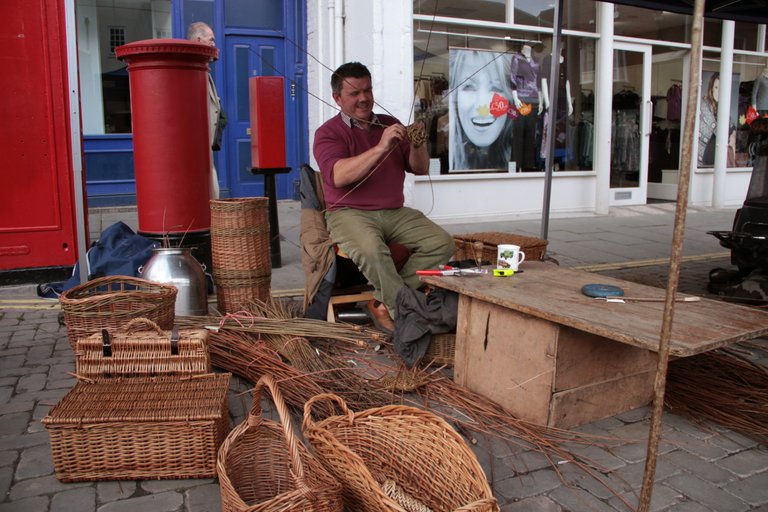 Basket weaver set up on the side of the road