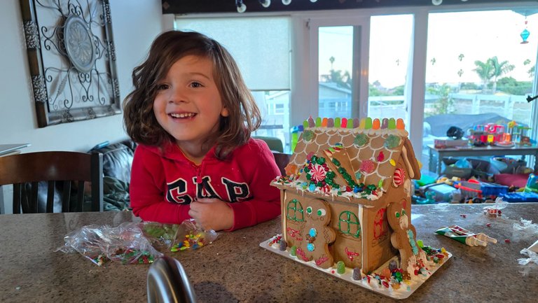 Icing his first gingerbread house