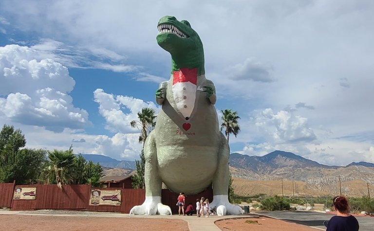 The T-Rex with a Pee-wee Herman outfit painted over his body in memory of Paul Reubens