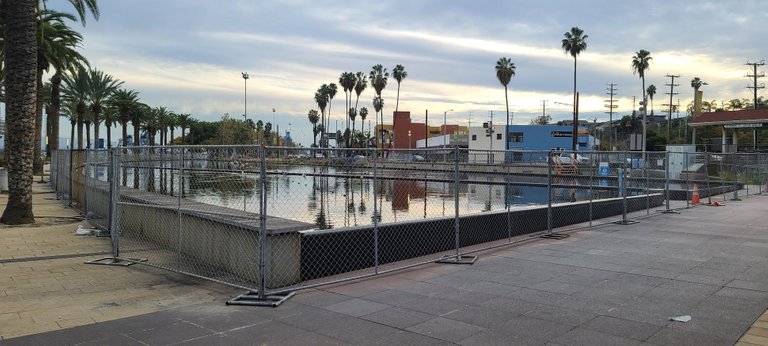 The fountain is now completely surrounded by fence