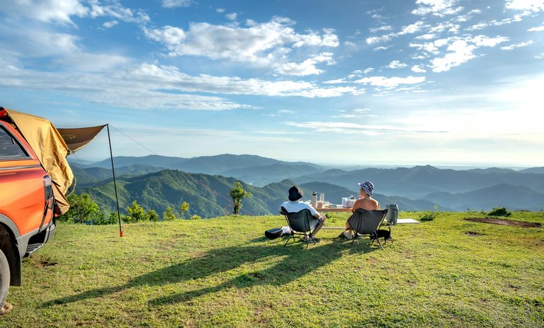 free-photo-of-couple-sitting-on-hilltop-in-countryside.jpeg