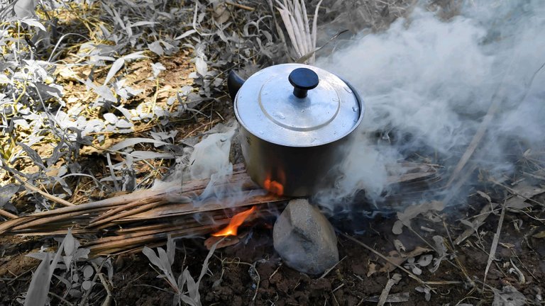 Repurposed electric kettle on open fire