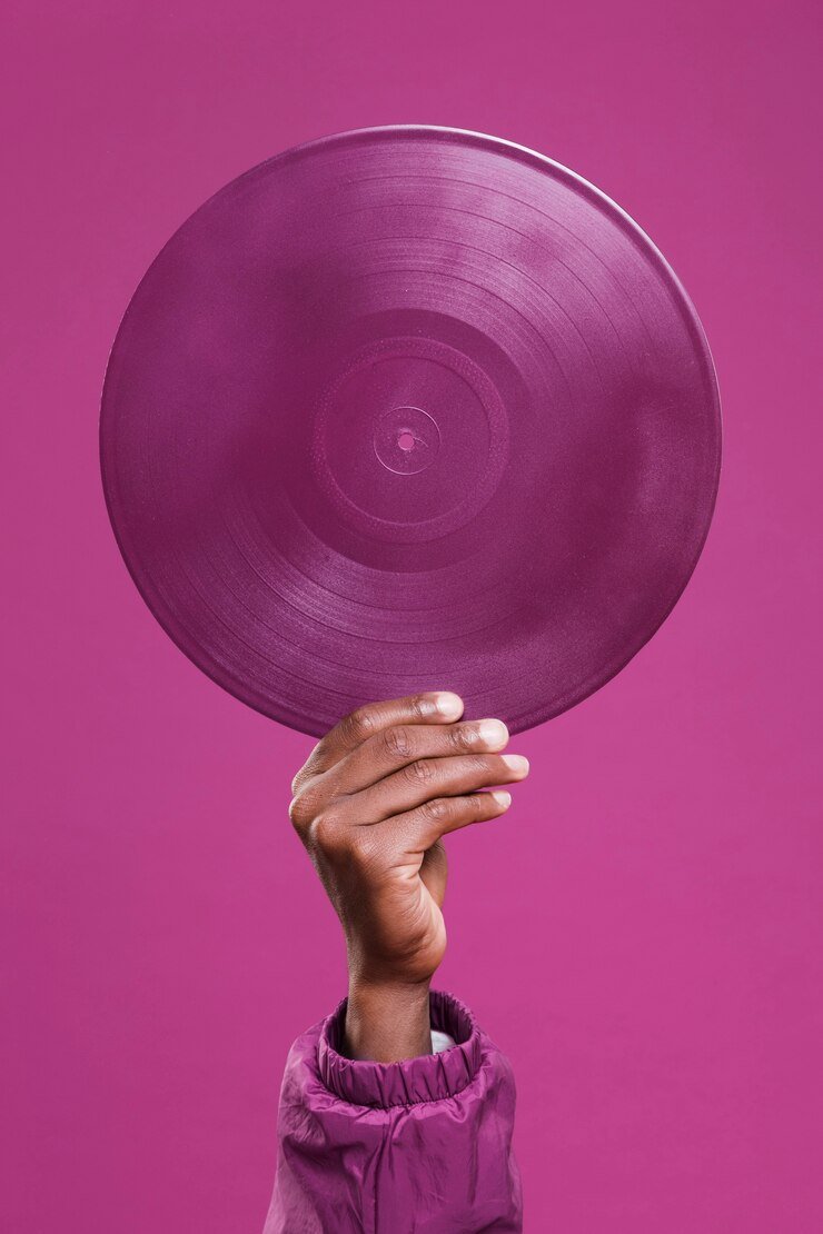 hand-holding-purple-vinyl_23-2148171698.jpg