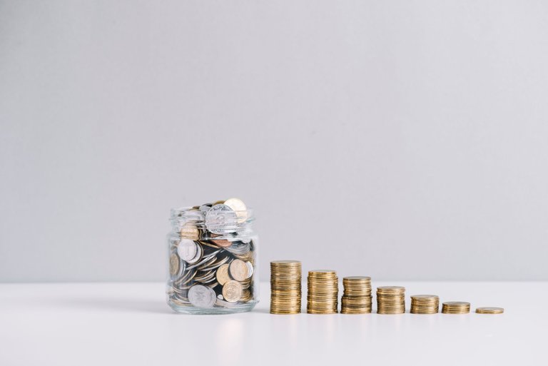 glass-jar-full-money-front-decreasing-stacked-coins-against-white-background.jpg