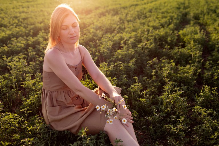 young-woman-posing-outdoors-field.jpg