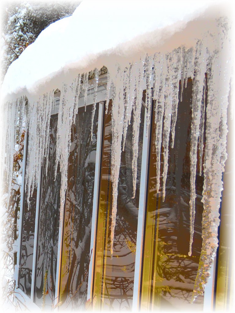close up section of icicles on sun room.JPG
