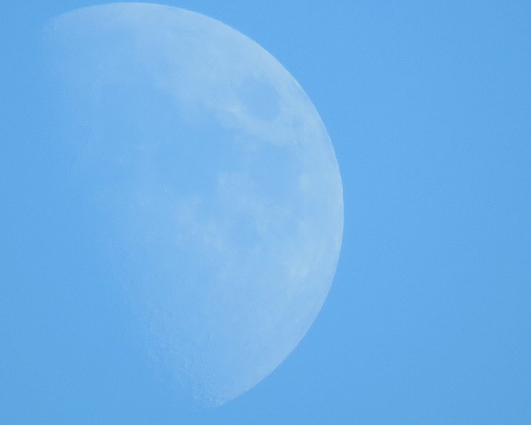 close up moon just over halk taken during day.JPG