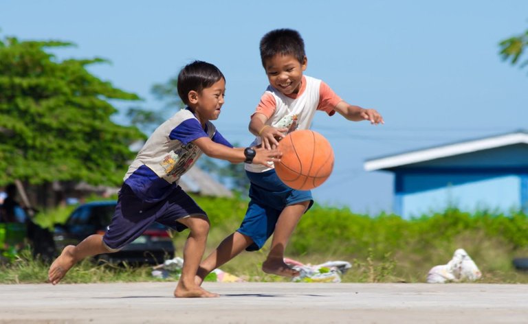 Happy kids playing basketball.jpeg