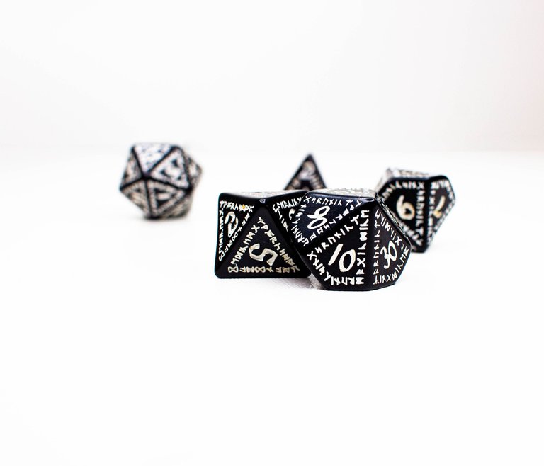 RPG dice in various shapes, runic on a white background.jpg