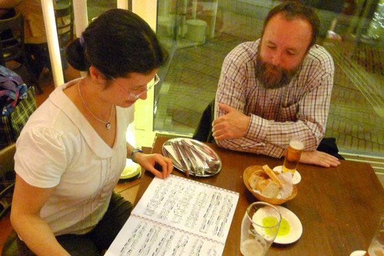 Kimiko and Werner studying the score