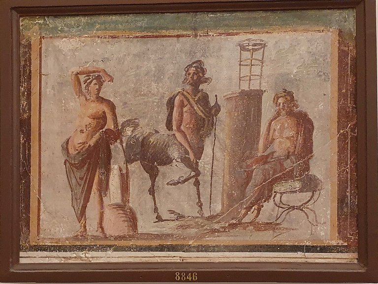 Fresco of Apollo Chiron Asclepios from Casa della Ballerino, Pompeii. Yair-haklai, CC BY-SA 4.0, via Wikimedia Commons.