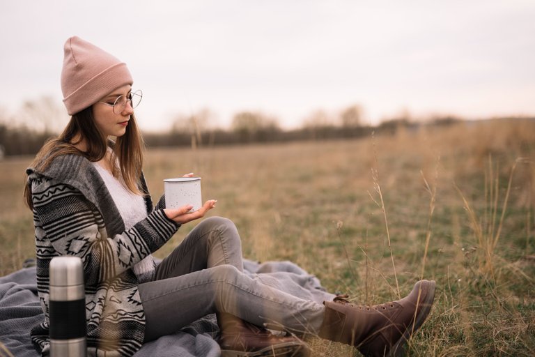 full-shot-woman-holding-coffee-cup.jpg