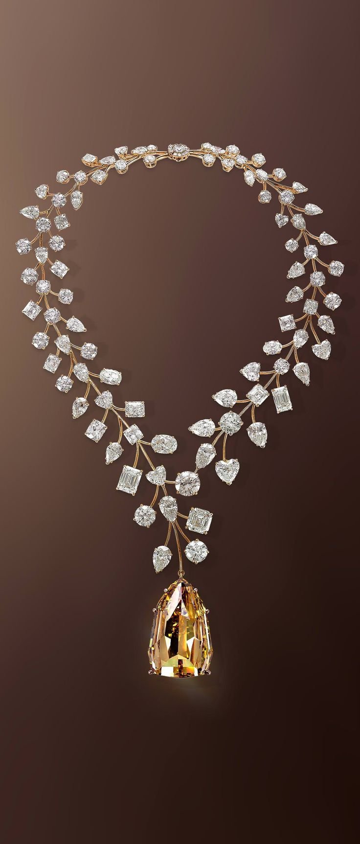 The Mouawad L’Incomparable Diamond Necklace Features the Flawless 407_48-Carat Yellow Diamond, Suspended from a White Diamond Necklace Intertwined by 18-Karat Rose Gold Branchlets.jpeg