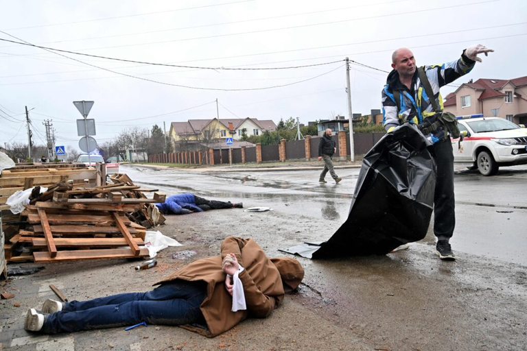 The body of a civilian man with his hands tied behind his back lies on the street in Bucha, April 3, 2022. Photo: SERGEI SUPINSKY / AFP via Getty Images