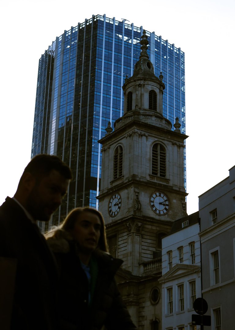 couple walking with the city in the background.jpg