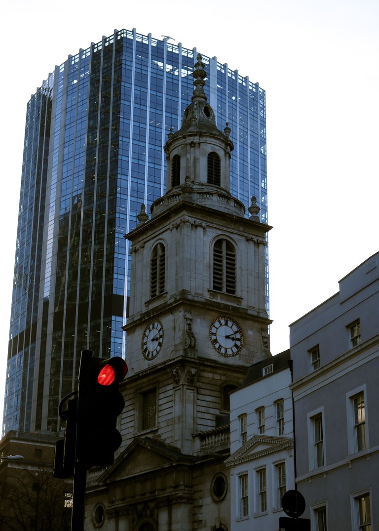 clock tower surrounded by buildings.jpg