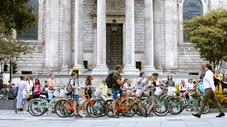 Cyclist Tourists on a break in front of St Pauls Cathedral.jpg