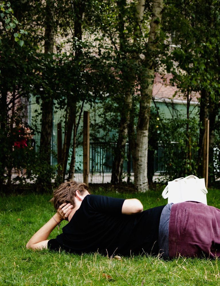 man chilling and laying on the grass.jpg