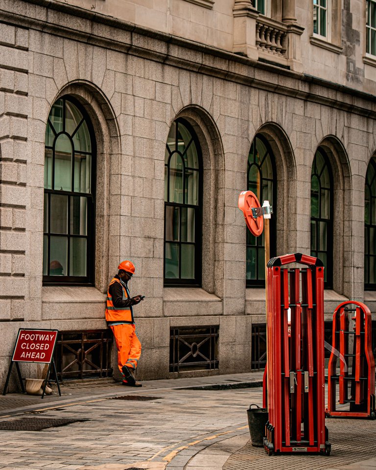 Road worker on a quick phone break.jpg