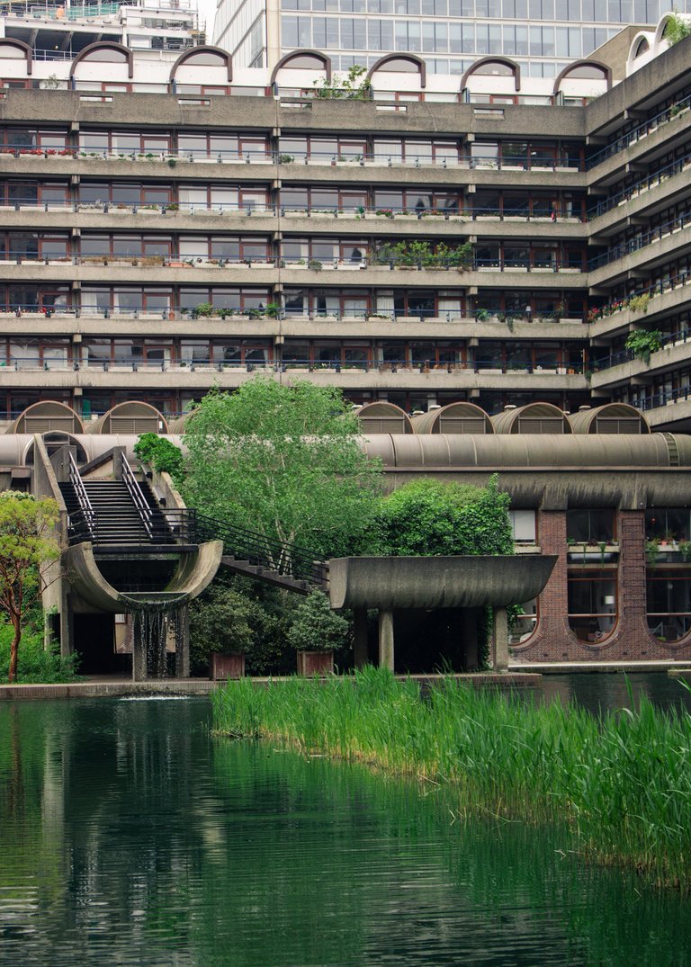 Apartments block with a pond in front.jpg