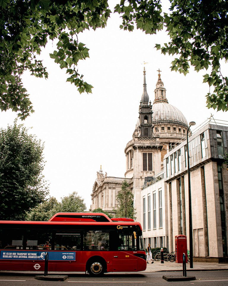 St Pauls Cathedral with a red bus passing by.jpg