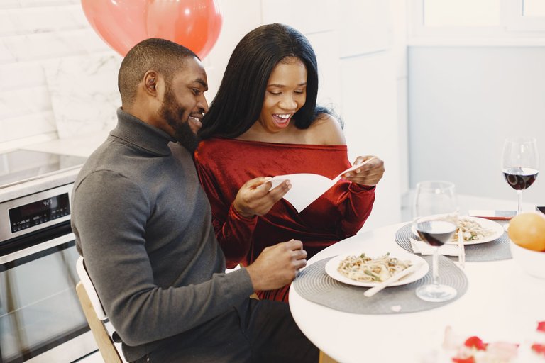couple-sitting-table-having-meal-talking-laughing-valentine-s-day.jpg