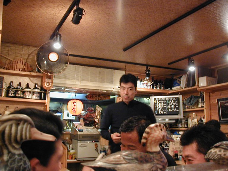 106 - A fishing theme restaurant. Some crazy guys who were sitting at the table next to me.