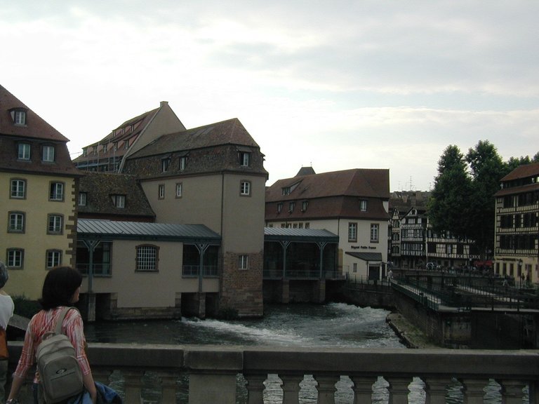 213-River flowing out from underneath hotel in Strasbourg.JPG