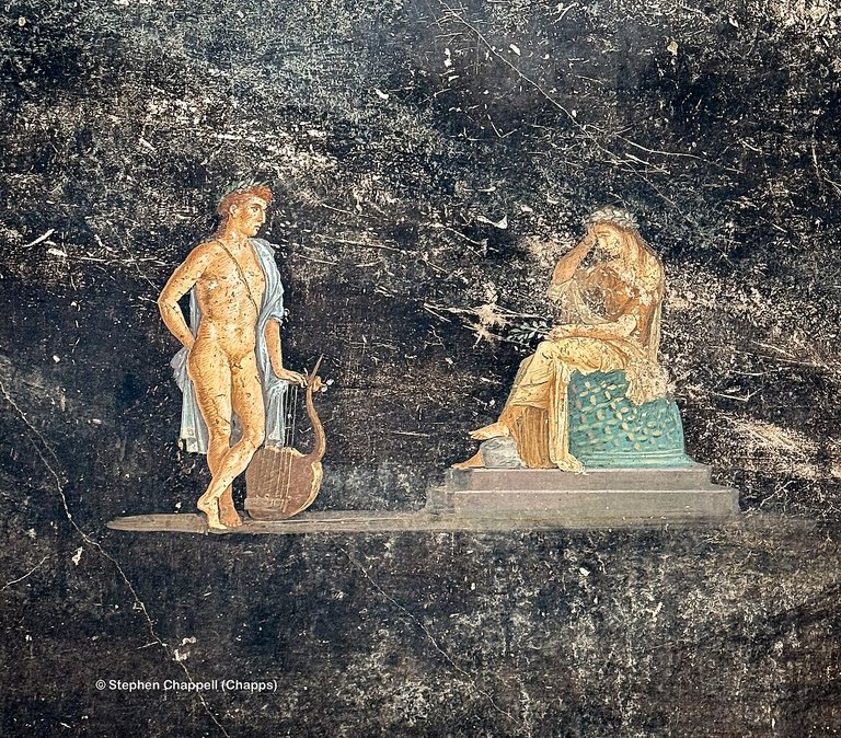 Fresco of Apollo and Cassandra from the newly excavated Black Room, Pompeii. Chappsnet, CC BY-SA 4.0, via Wikimedia Commons.
